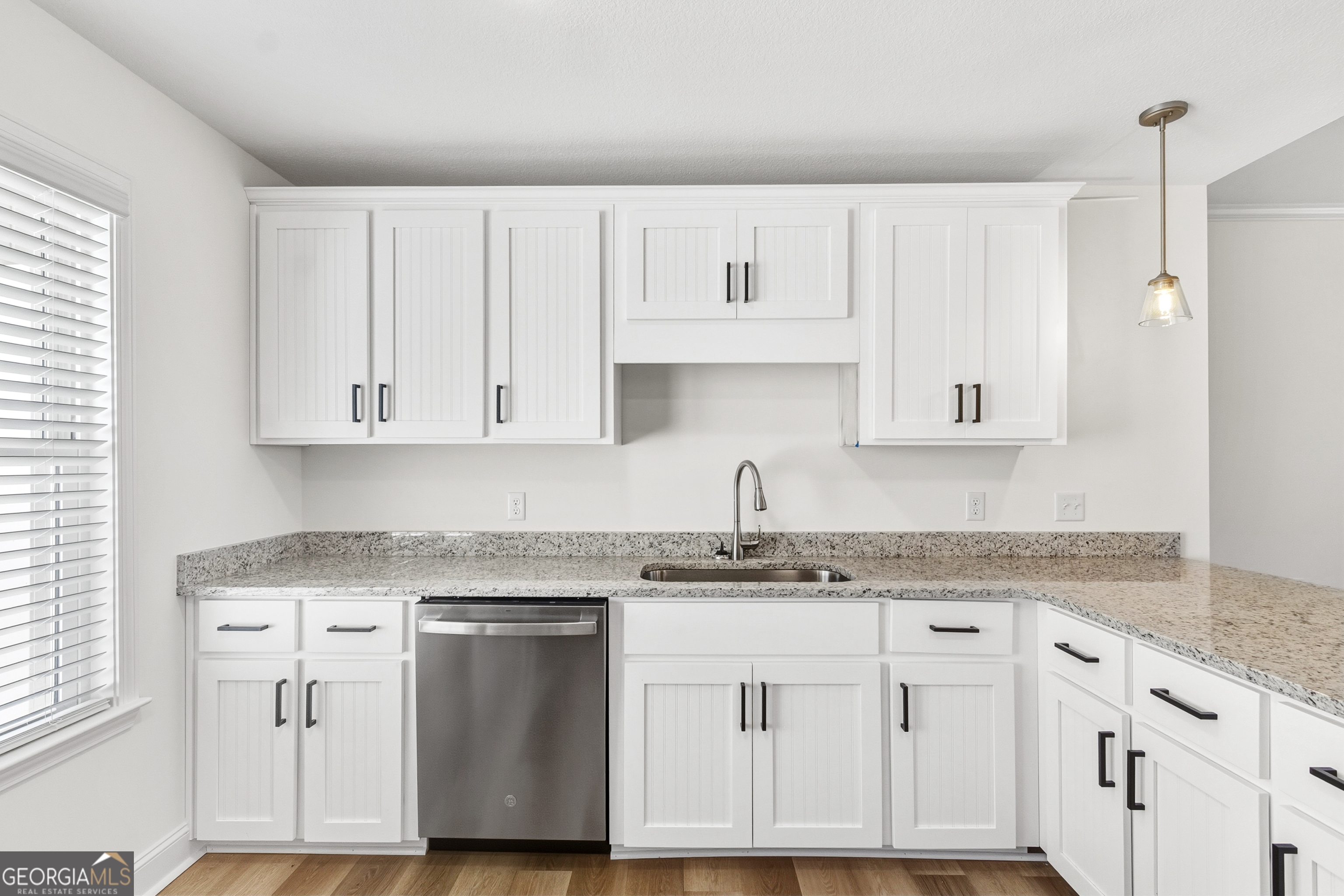 477 Jack Kennedy Road Statesboro, GA 30458 - Photo 14 of 32 a kitchen with granite countertop white cabinets and white appliances