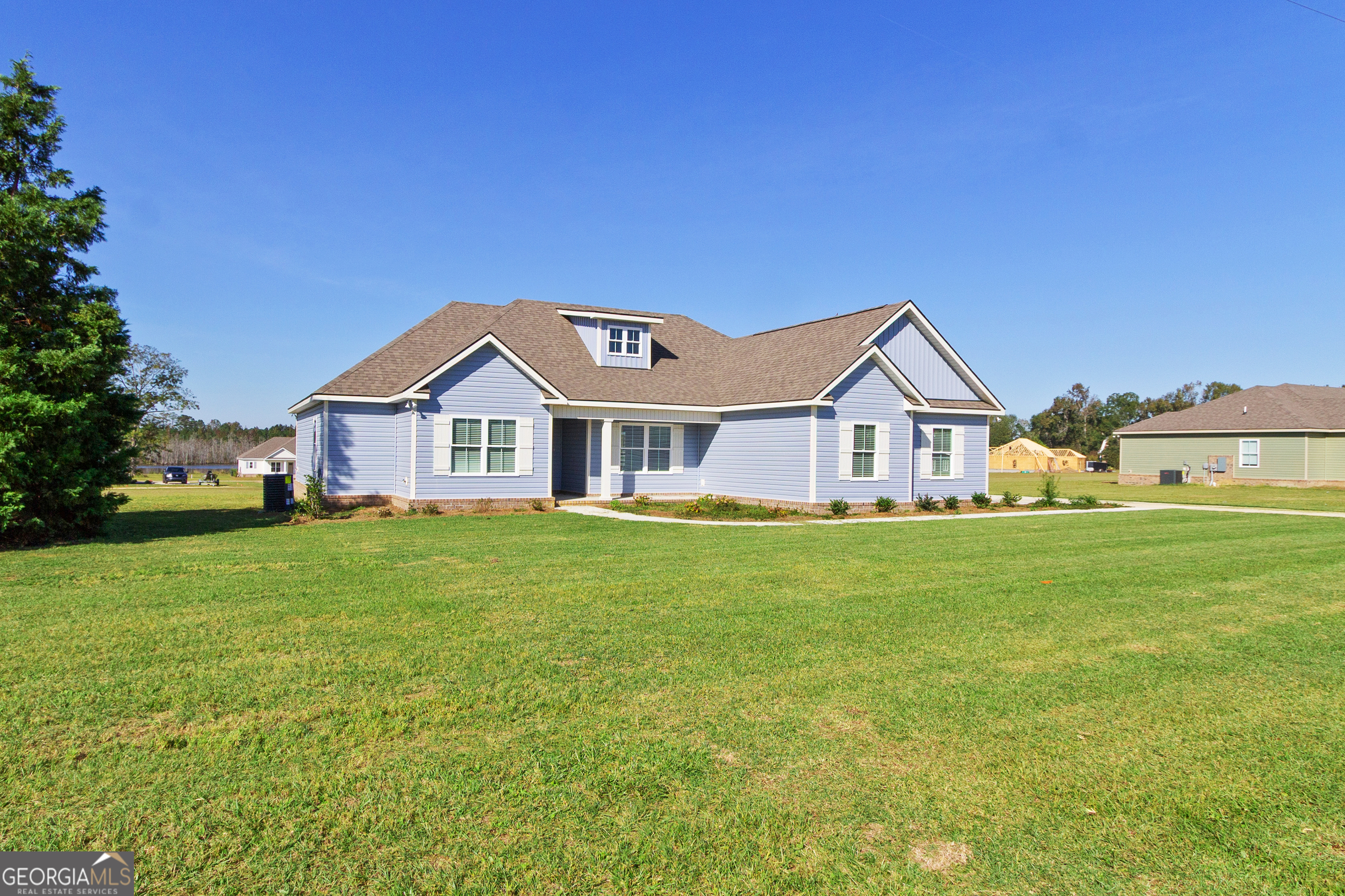 477 Jack Kennedy Road Statesboro, GA 30458 - Photo 2 of 32 a view of a house with a big yard