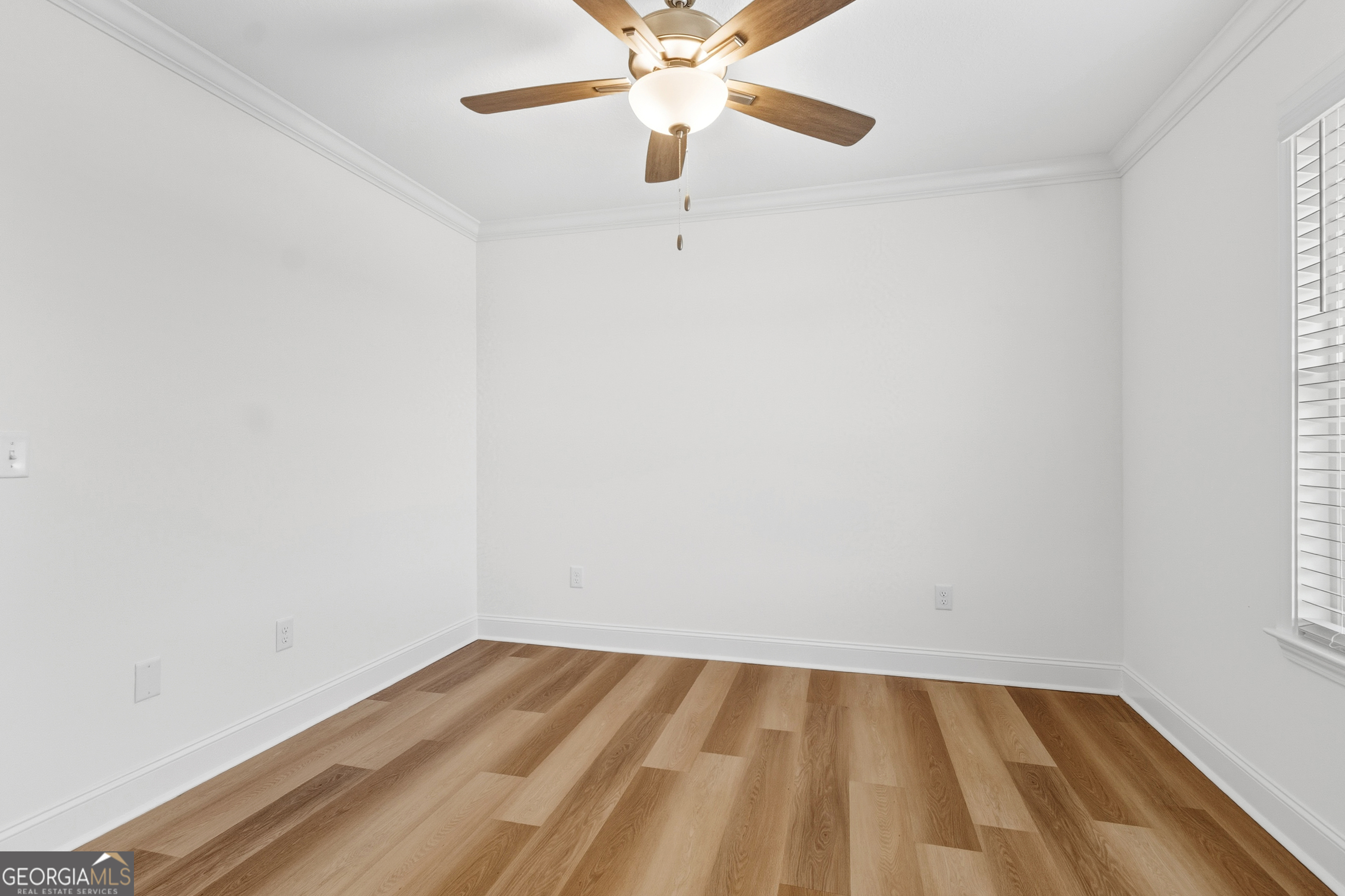 477 Jack Kennedy Road Statesboro, GA 30458 - Photo 21 of 32 a view of an empty room with a window