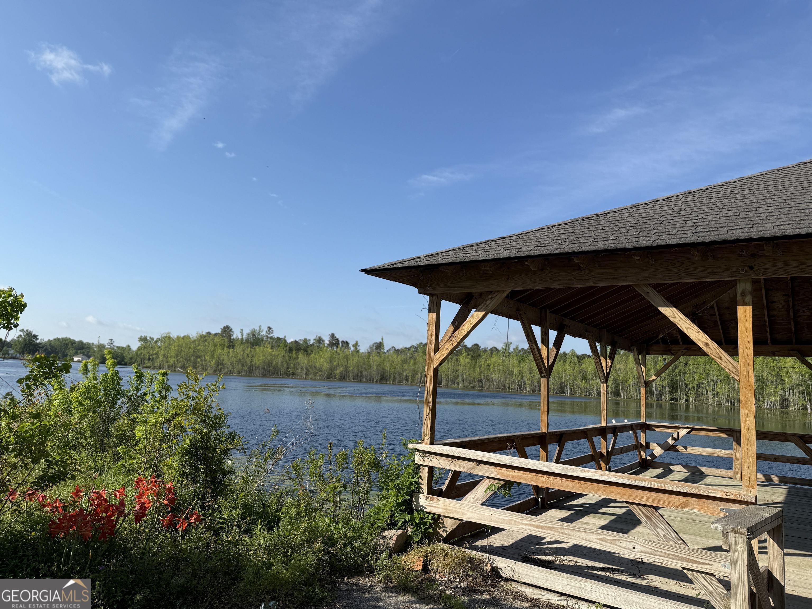 477 Jack Kennedy Road Statesboro, GA 30458 - Photo 29 of 32 a view of a patio with chairs next to a yard
