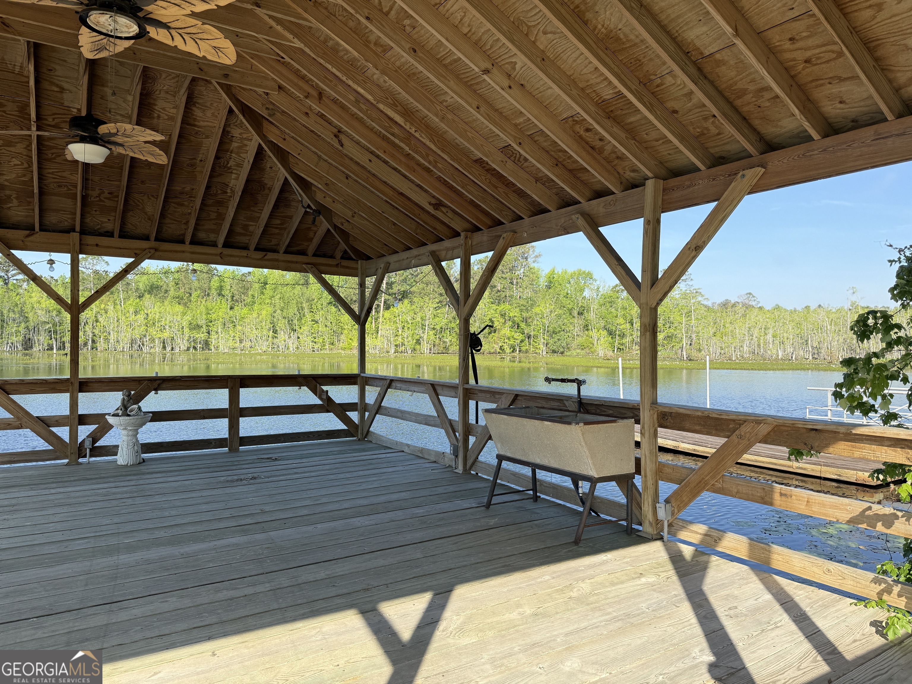 477 Jack Kennedy Road Statesboro, GA 30458 - Photo 31 of 32 a view of chairs and tables in the patio