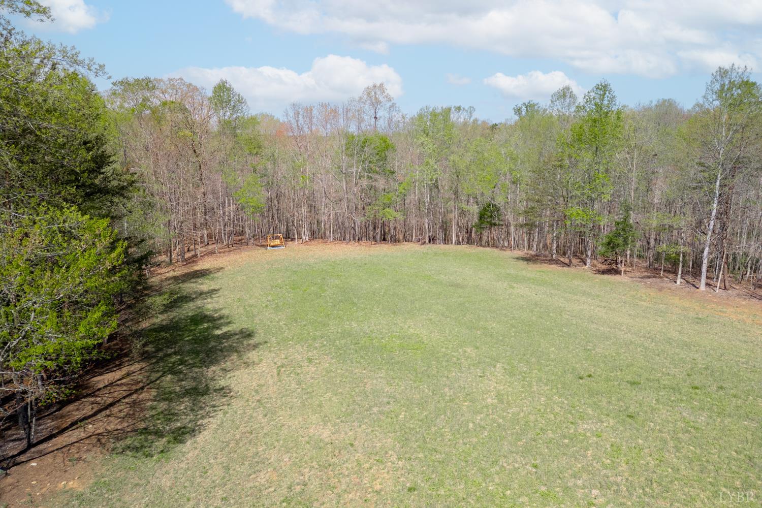0 Lots 7-10 Lewis Ford Road Brookneal, VA 24528 - Photo 3 of 28 a view of a field with trees in the background