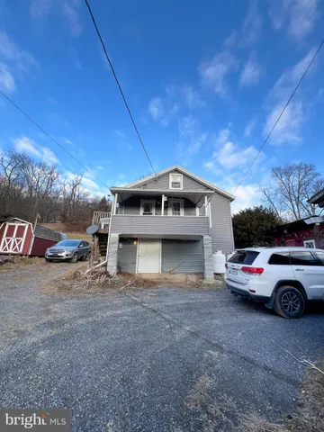 a car parked in front of a house