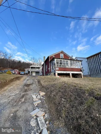 a view of a big house with a yard