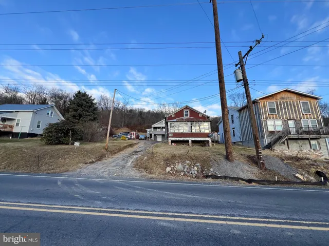 a view of a house with a street