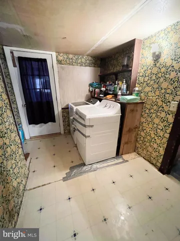 a living room with a couch and a fireplace