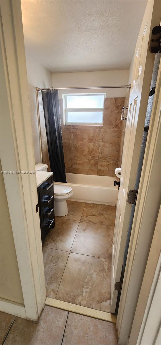 880 East 26th Street Hialeah, FL 33013 - Photo 24 of 34 a bathroom with a sink a toilet and a shower