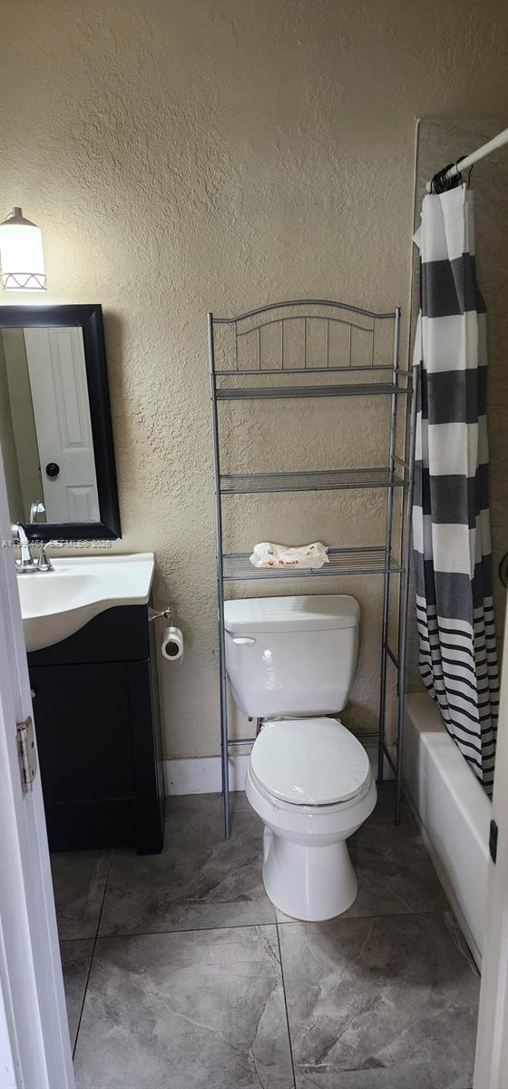 880 East 26th Street Hialeah, FL 33013 - Photo 29 of 34 a bathroom with a toilet and a shower