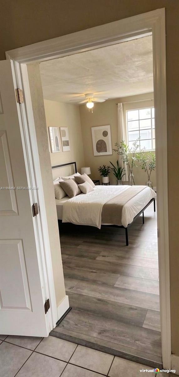 880 East 26th Street Hialeah, FL 33013 - Photo 3 of 34 a en suite bathroom with a bed and a mirror