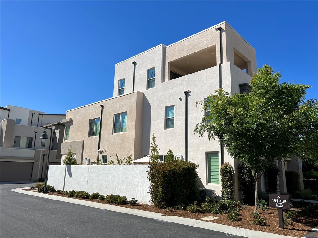 109 Stage Irvine, CA 92618 - Photo 1 of 1 a front view of a building with a garden
