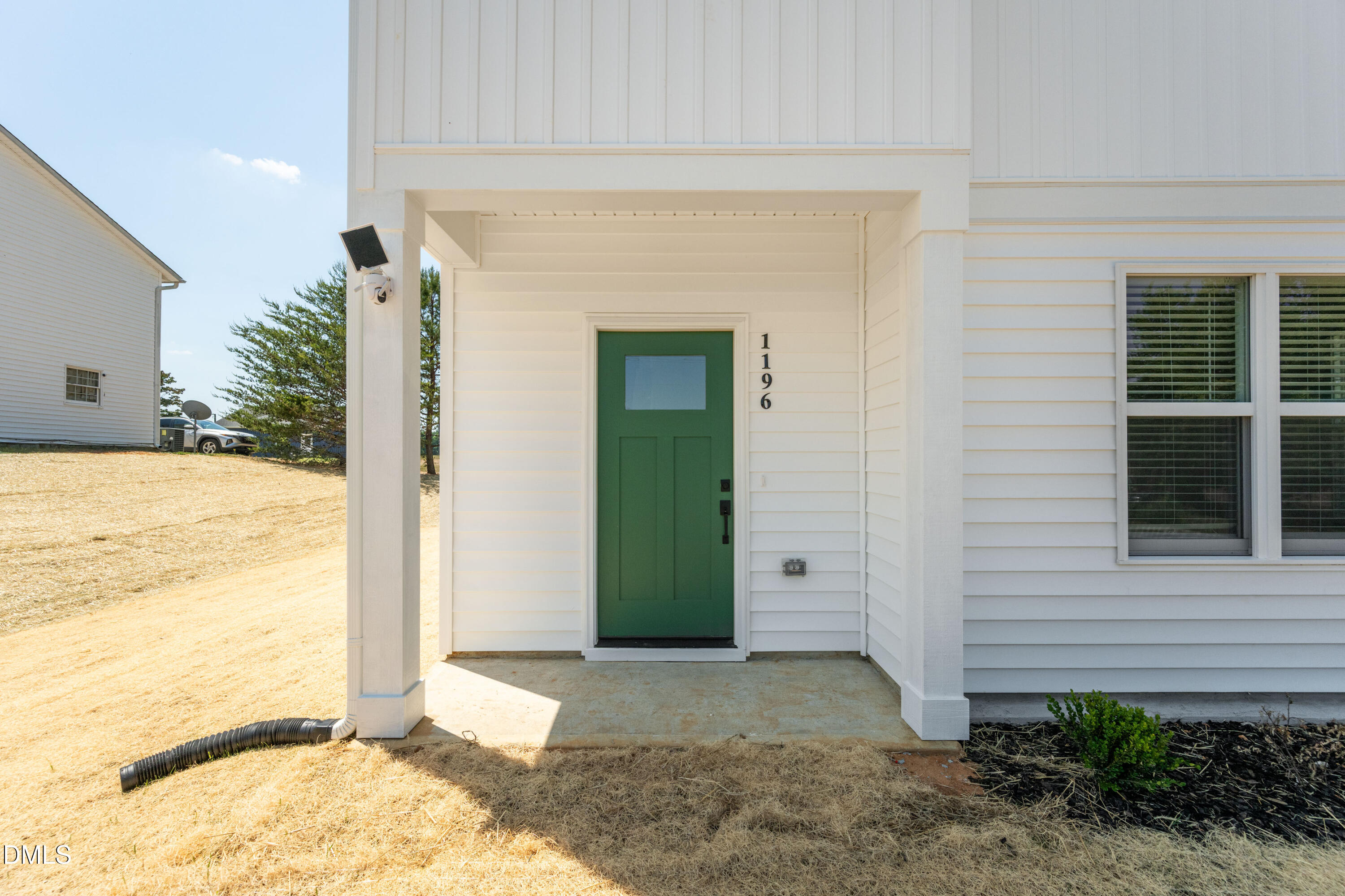 1196 Hurdle Mills Road Roxboro, NC 27573 - Photo 8 of 50 a view of a house with a outdoor space