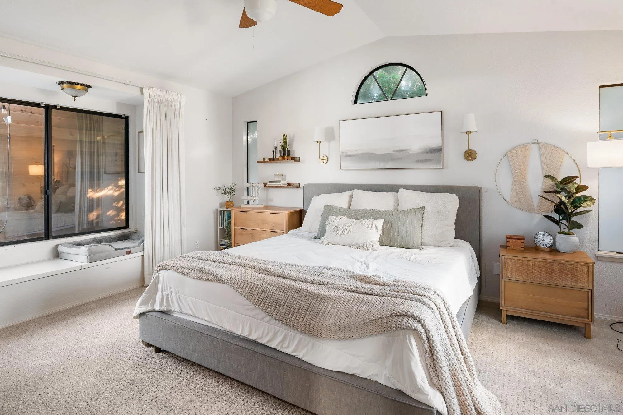 3491 Shawnee Road San Diego, CA 92117 - Photo 25 of 66 a spacious bedroom with a bed a couch and a window