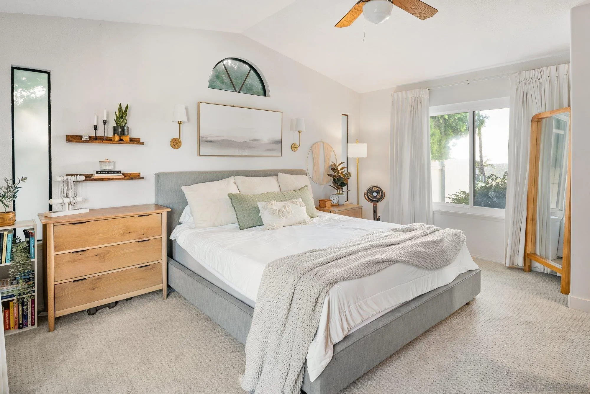 3491 Shawnee Road San Diego, CA 92117 - Photo 26 of 66 a bedroom with a bed and a chandelier