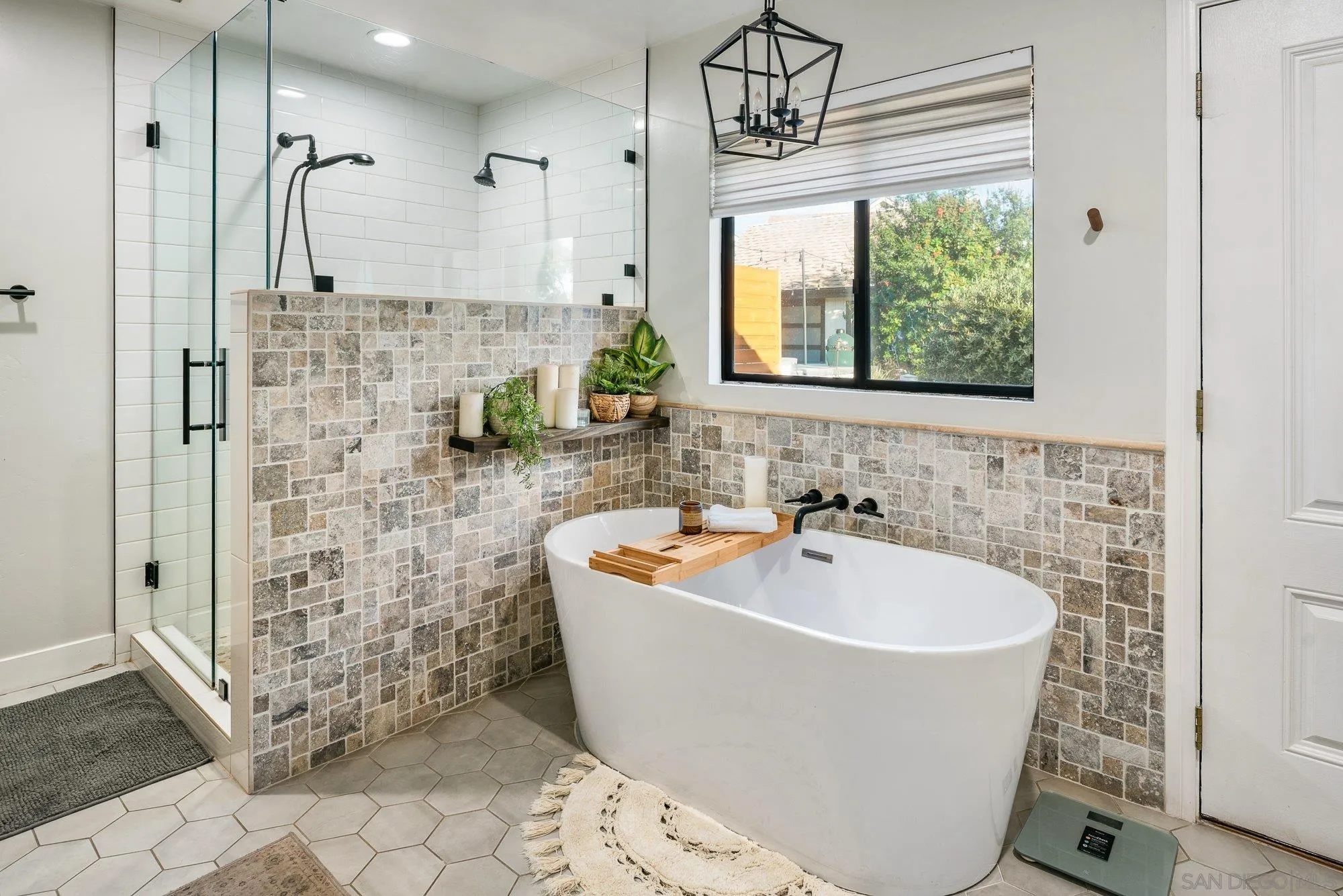 3491 Shawnee Road San Diego, CA 92117 - Photo 29 of 66 a bathroom with a bathtub sink and window