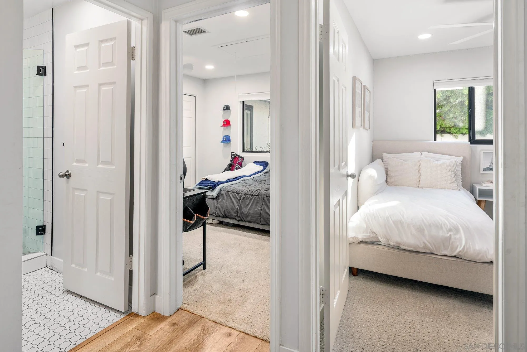 3491 Shawnee Road San Diego, CA 92117 - Photo 32 of 66 a view of a bedroom with a bed and wooden floor