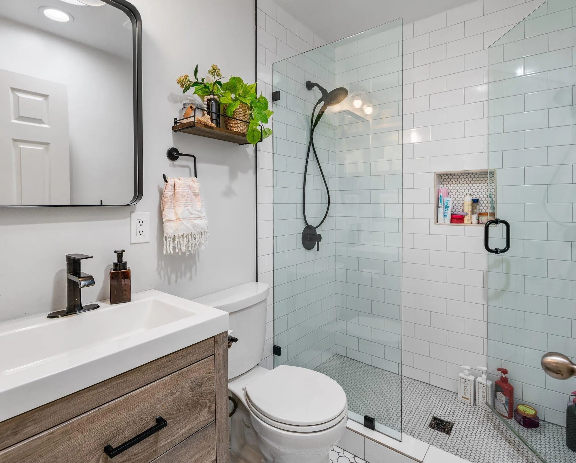 3491 Shawnee Road San Diego, CA 92117 - Photo 35 of 66 a bathroom with a shower sink vanity mirror and toilet