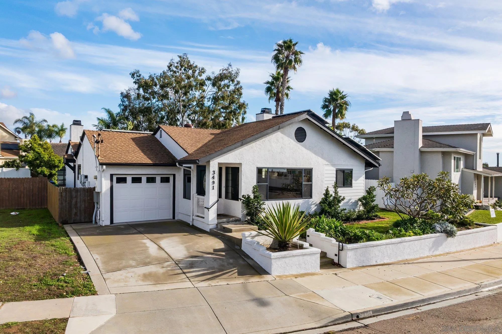 3491 Shawnee Road San Diego, CA 92117 - Photo 4 of 66 a view of a house with yard and plants