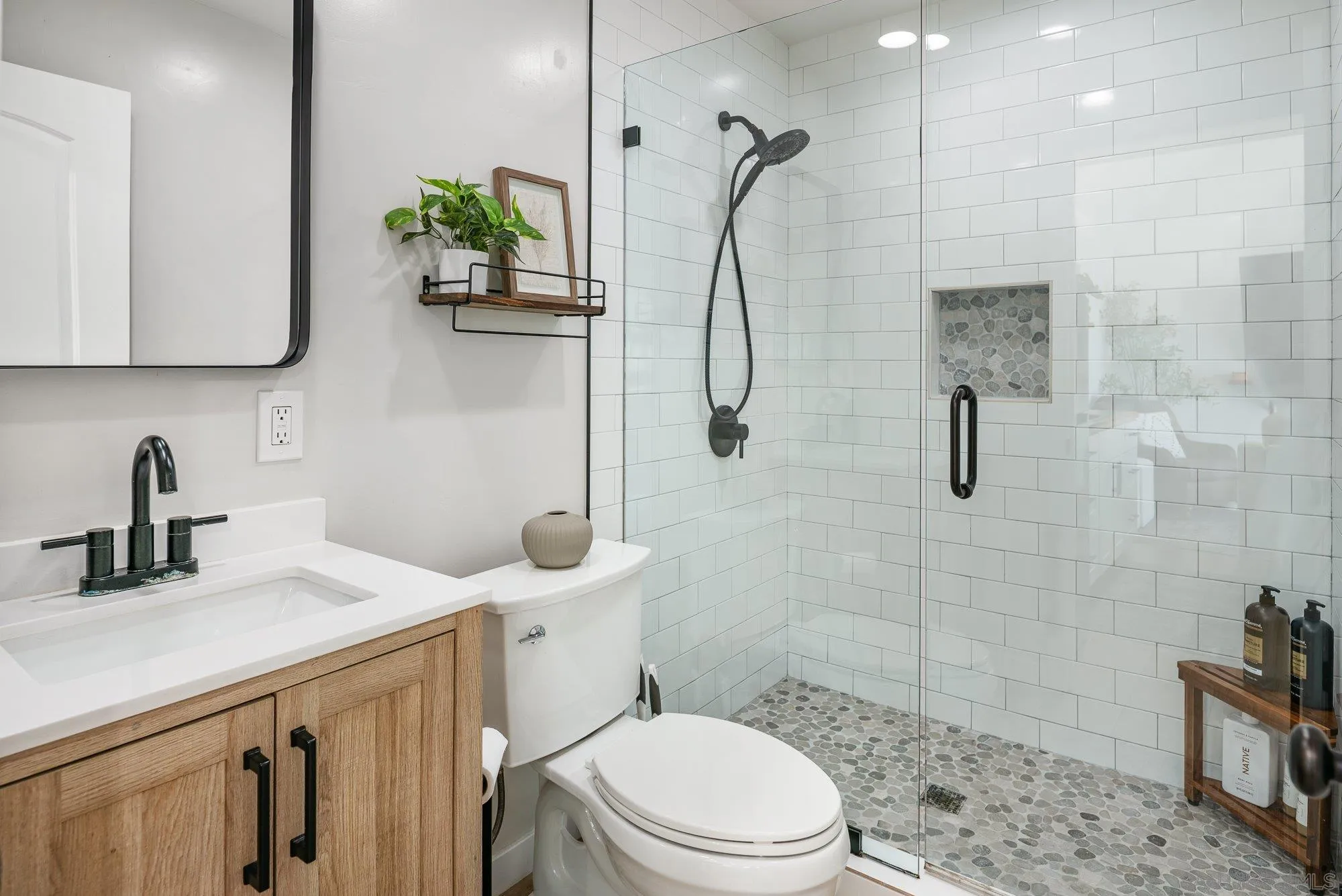3491 Shawnee Road San Diego, CA 92117 - Photo 42 of 66 a bathroom with a sink a toilet and shower