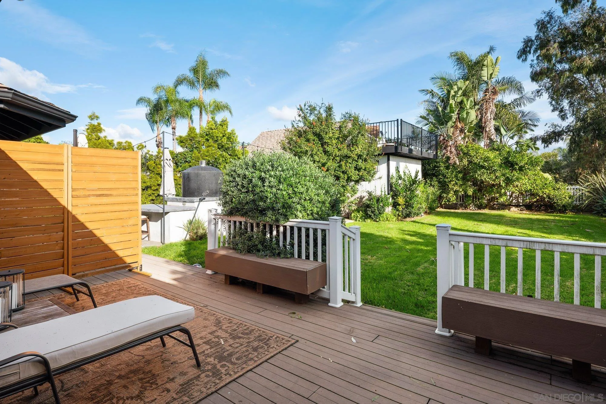3491 Shawnee Road San Diego, CA 92117 - Photo 48 of 66 a view of a chair and table on the wooden deck