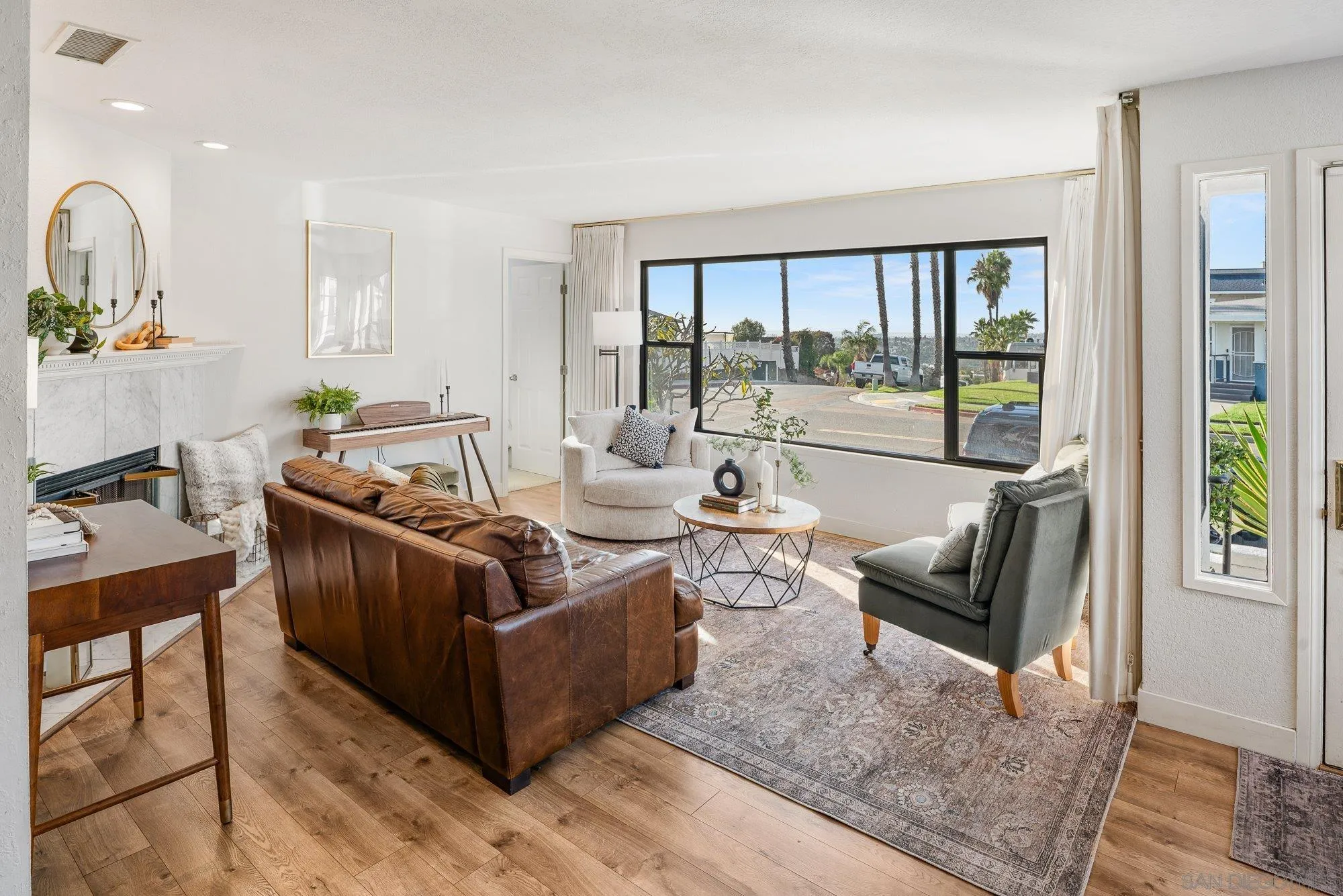 3491 Shawnee Road San Diego, CA 92117 - Photo 7 of 66 a living room with furniture and a large window