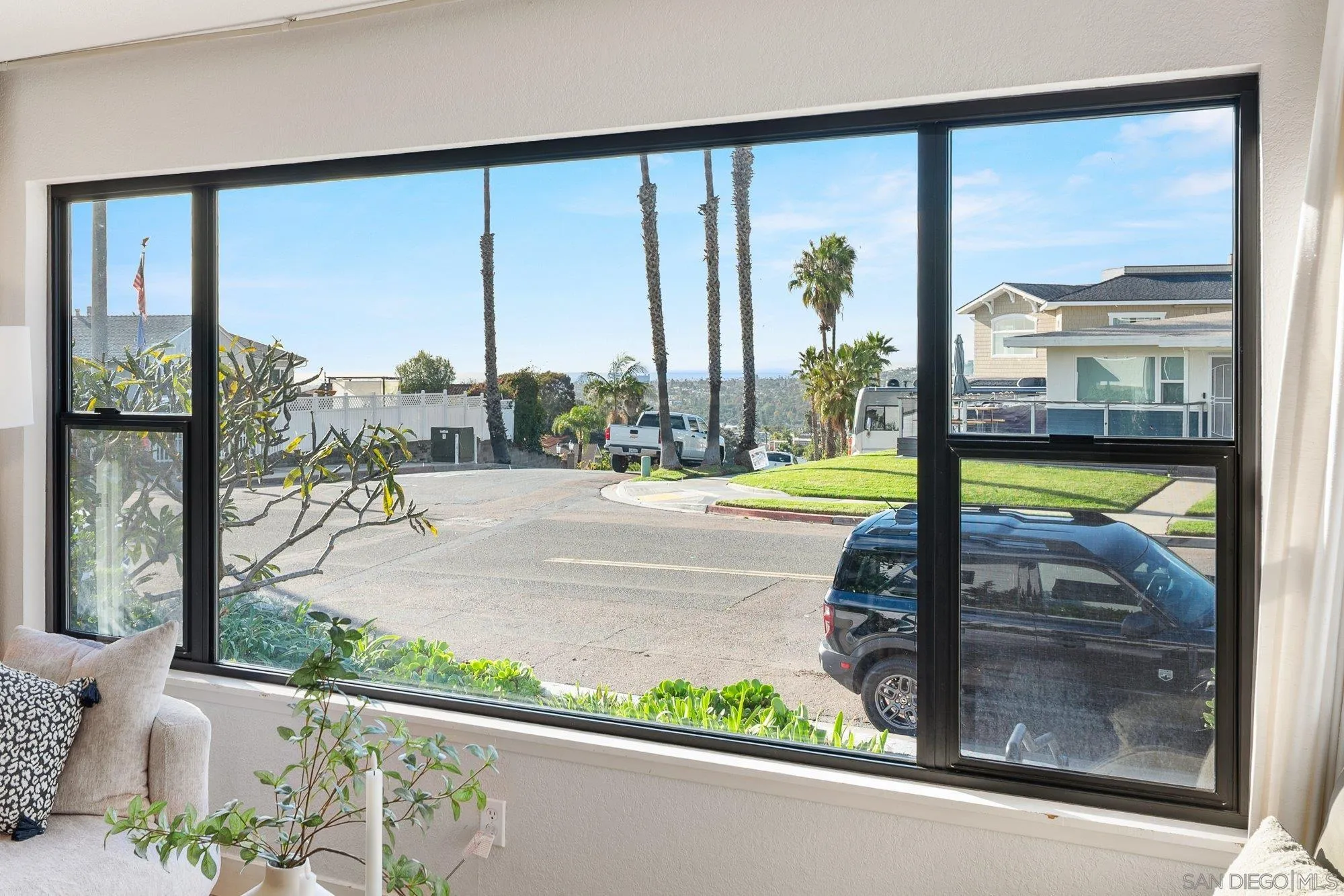 3491 Shawnee Road San Diego, CA 92117 - Photo 8 of 66 a view of a floor to ceiling window and a living room