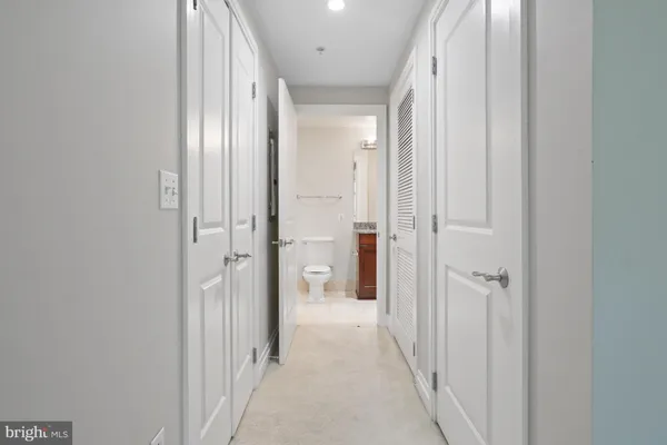 a view of a bathroom from a hallway