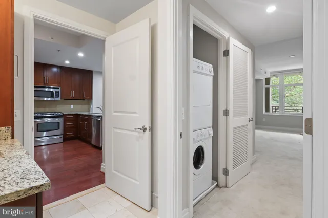 a view of a kitchen cabinets and stainless steel appliances