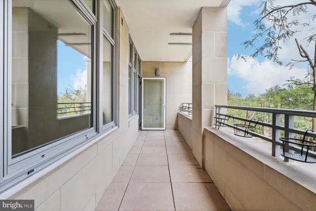 a view of a balcony with furniture