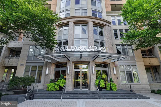 a view of a large building with a yard