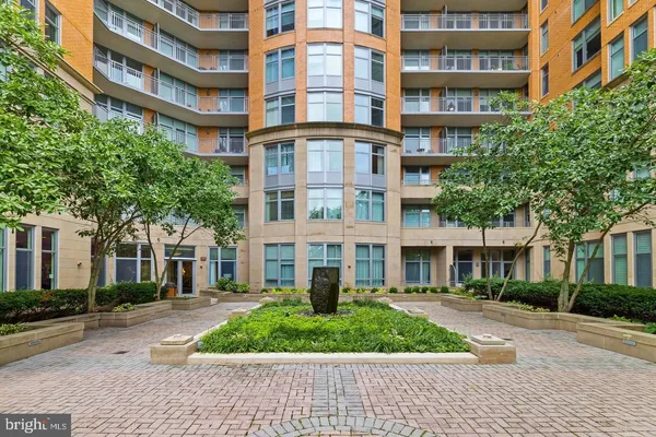 a view of a chair and tables in the patio of the house