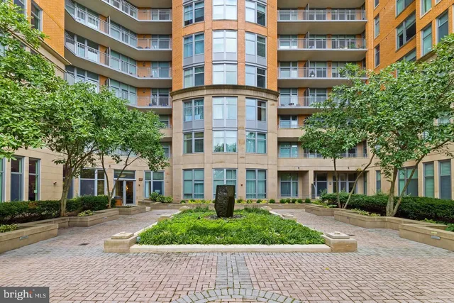 a view of a chair and tables in the patio of the house