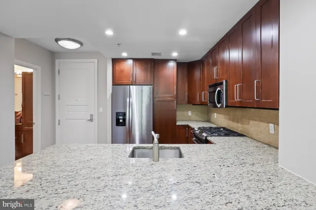 a lobby with a couch and a mirror