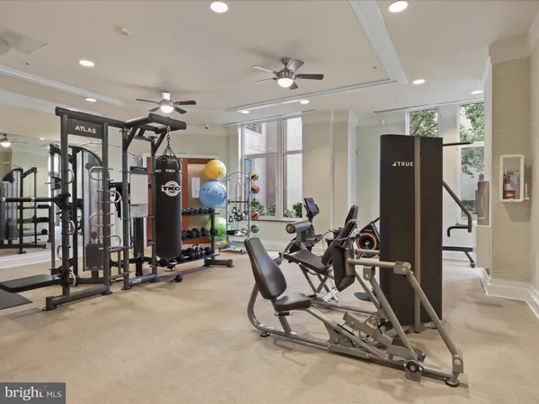 a room with pool table and windows