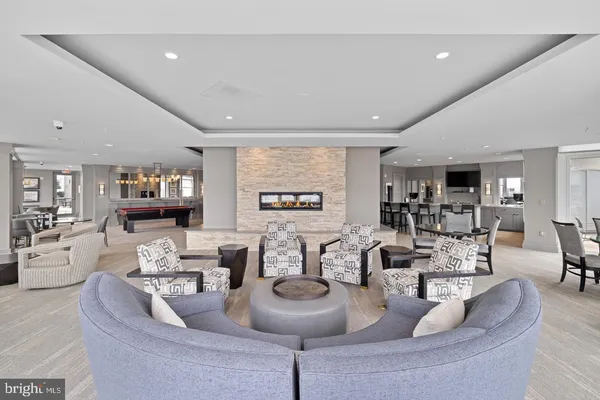 a view of a swimming pool and an outdoor seating