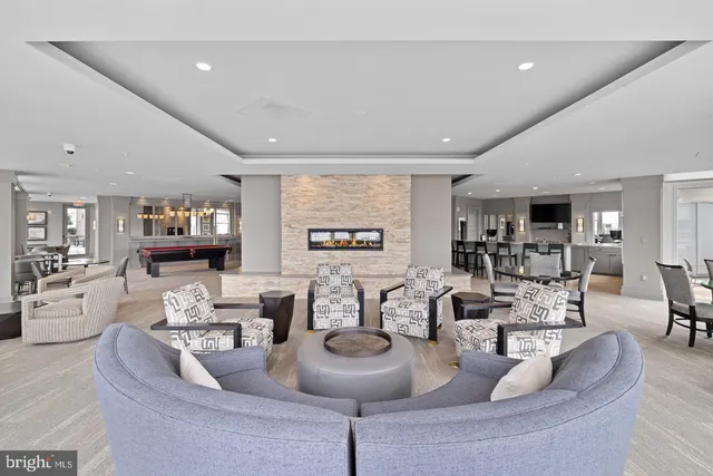 a view of a swimming pool and an outdoor seating