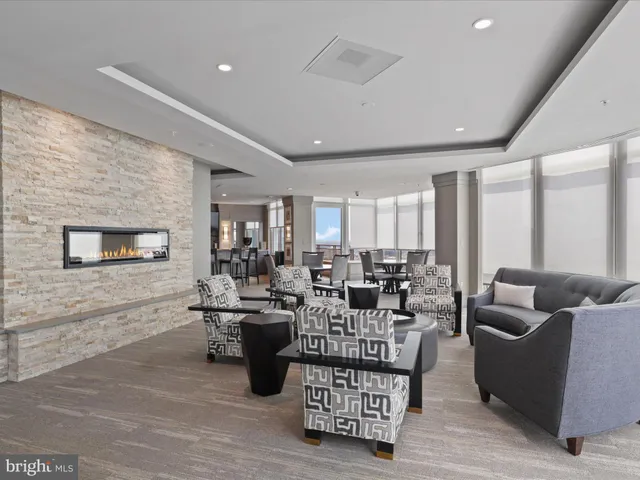 a kitchen with a dining table chairs and flat screen tv