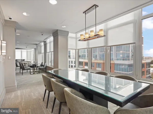a kitchen with granite countertop a table and chairs