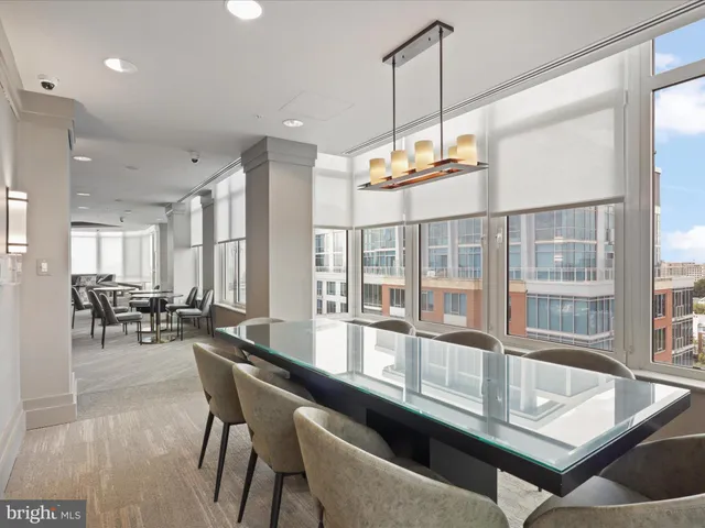 a kitchen with granite countertop a table and chairs