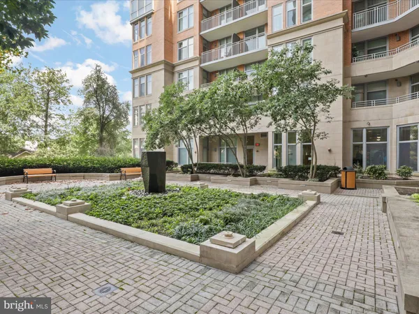 a city street lined with buildings and trees