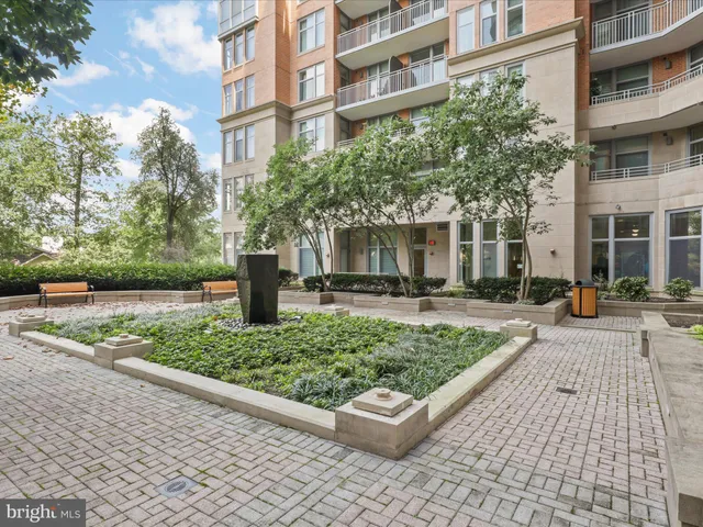 a city street lined with buildings and trees