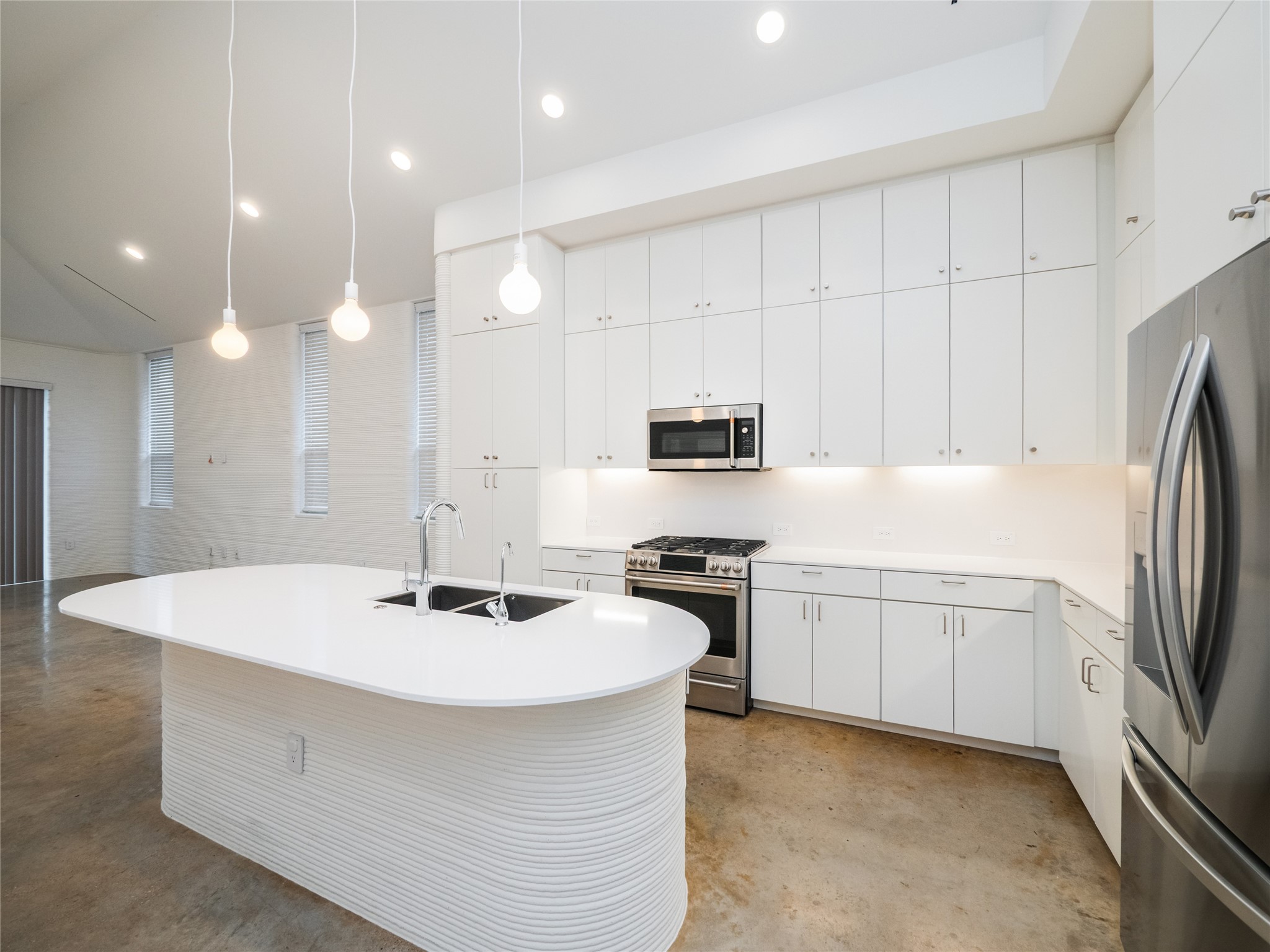 304 Painted Sunset Drive Georgetown, TX 78628 - Photo 11 of 38 a kitchen with stainless steel appliances a stove a sink a refrigerator and white cabinets