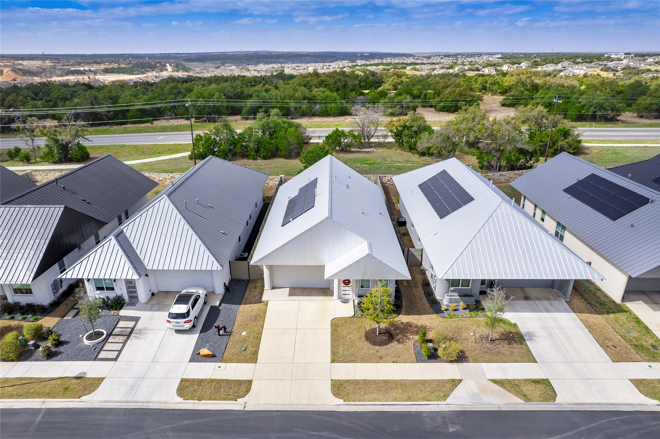 304 Painted Sunset Drive Georgetown, TX 78628 - Photo 2 of 38 a view of a patio with table and chairs near a lake view