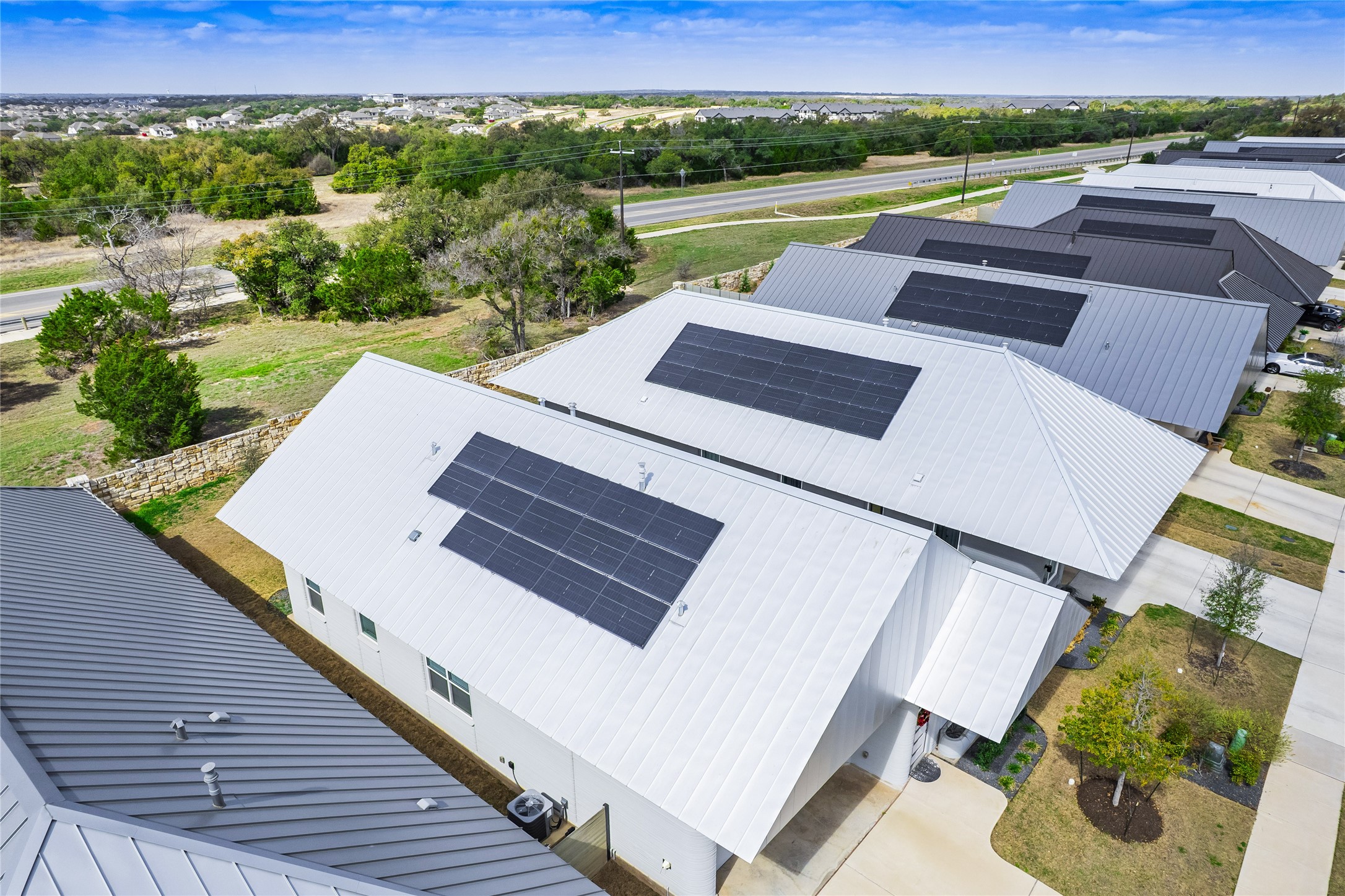 304 Painted Sunset Drive Georgetown, TX 78628 - Photo 30 of 38 a view of a patio with lawn chairs next to a yard