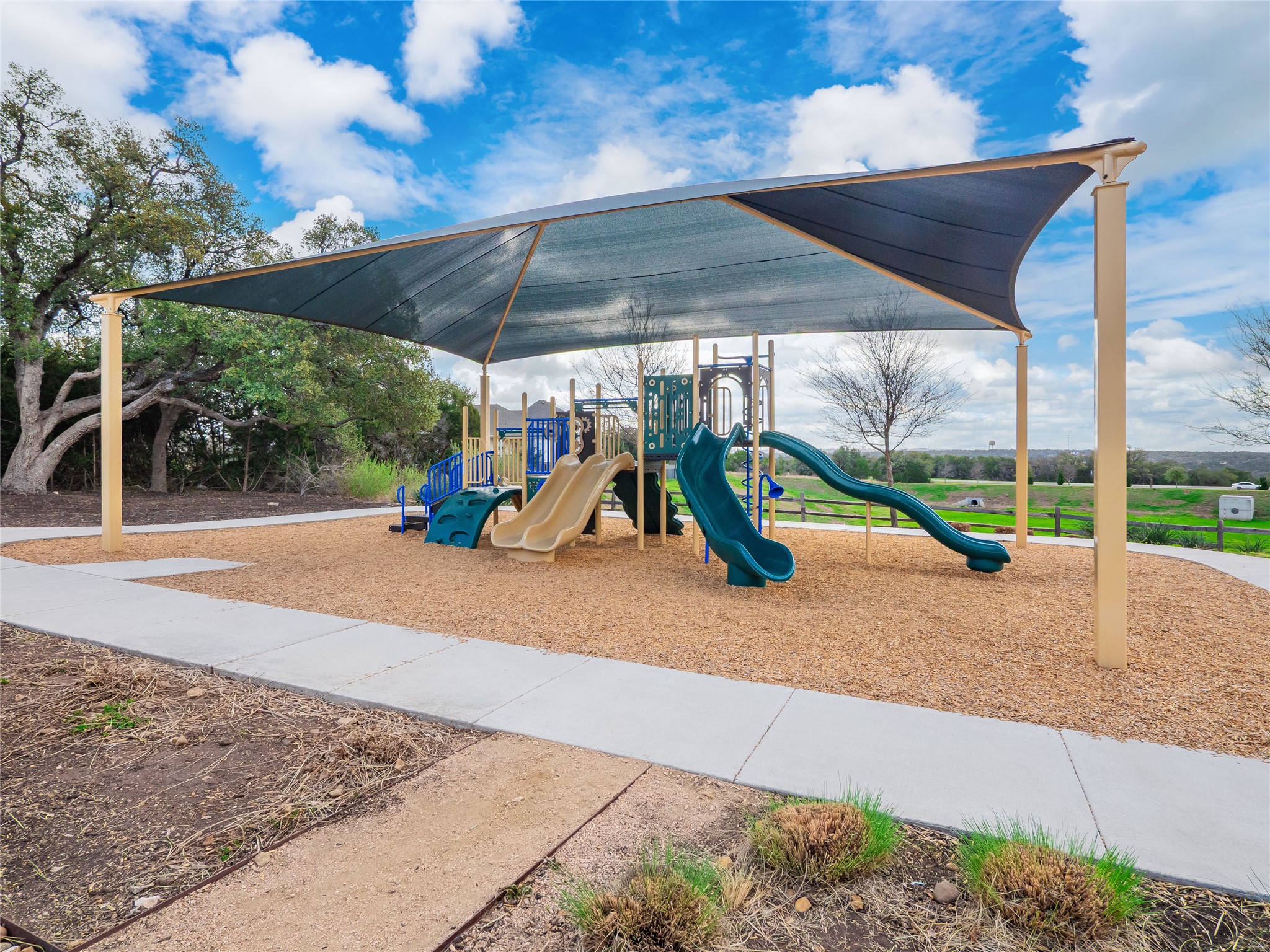 304 Painted Sunset Drive Georgetown, TX 78628 - Photo 33 of 38 a view of outdoor space with playground and green space
