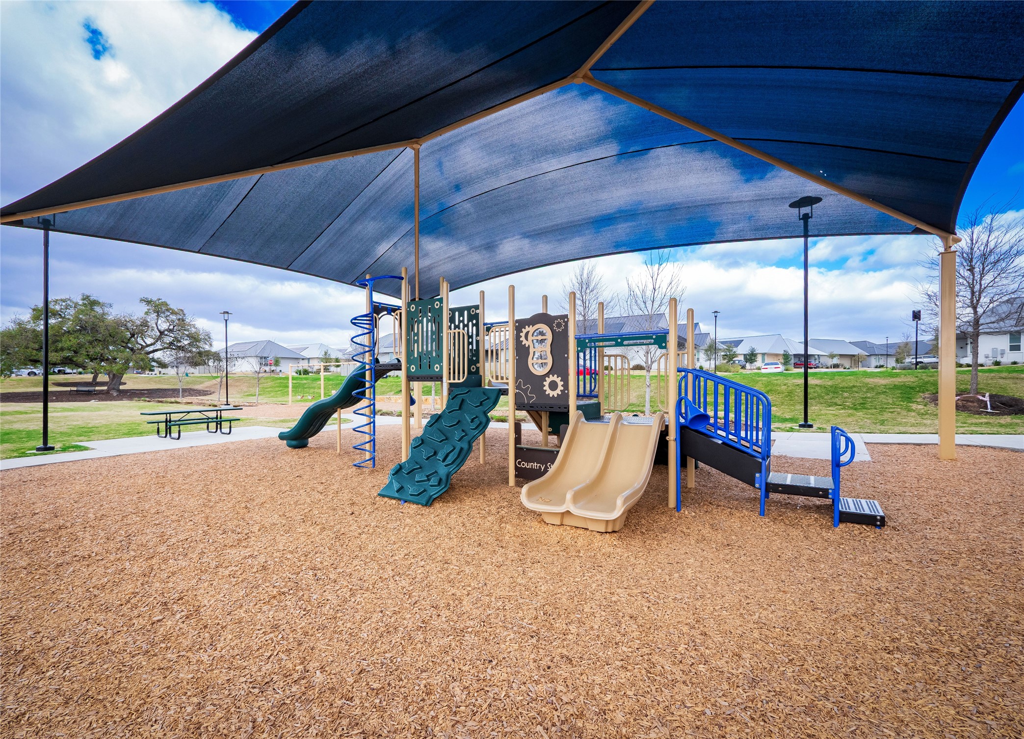 304 Painted Sunset Drive Georgetown, TX 78628 - Photo 34 of 38 a view of a room with wooden floor windows and table and chairs