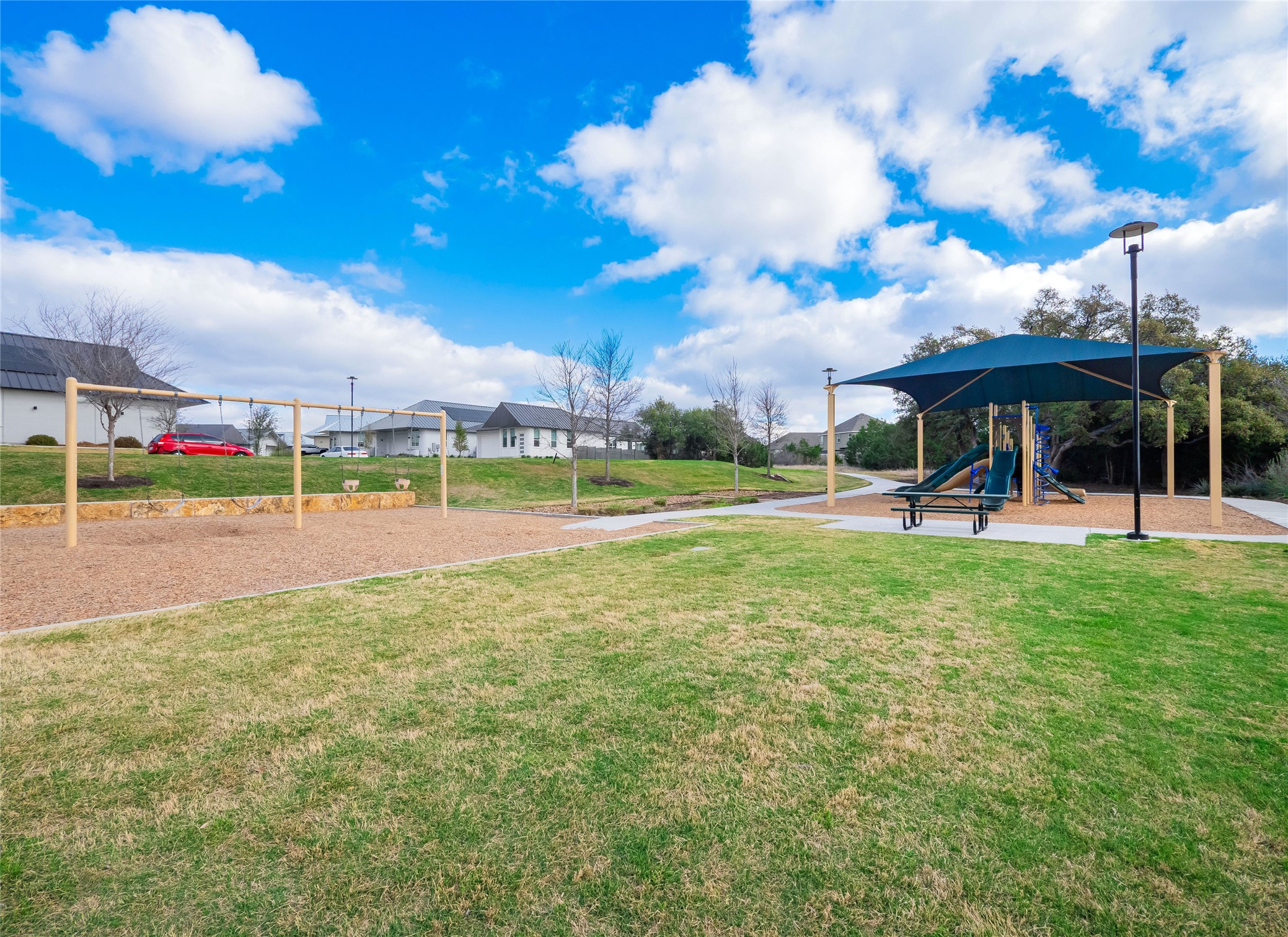 304 Painted Sunset Drive Georgetown, TX 78628 - Photo 36 of 38 a view of a playground with basketball court