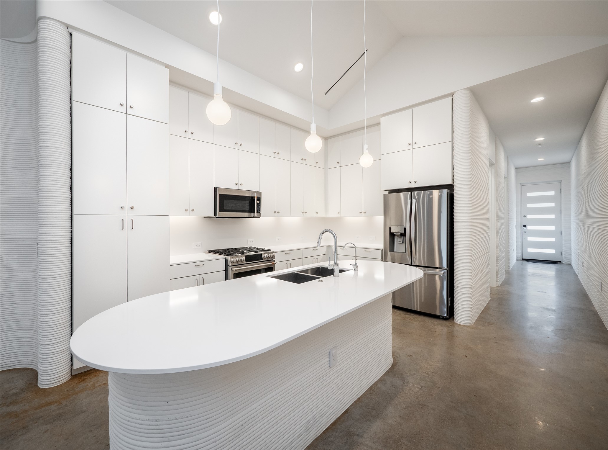 304 Painted Sunset Drive Georgetown, TX 78628 - Photo 9 of 38 a kitchen with stainless steel appliances a refrigerator stove microwave and cabinets