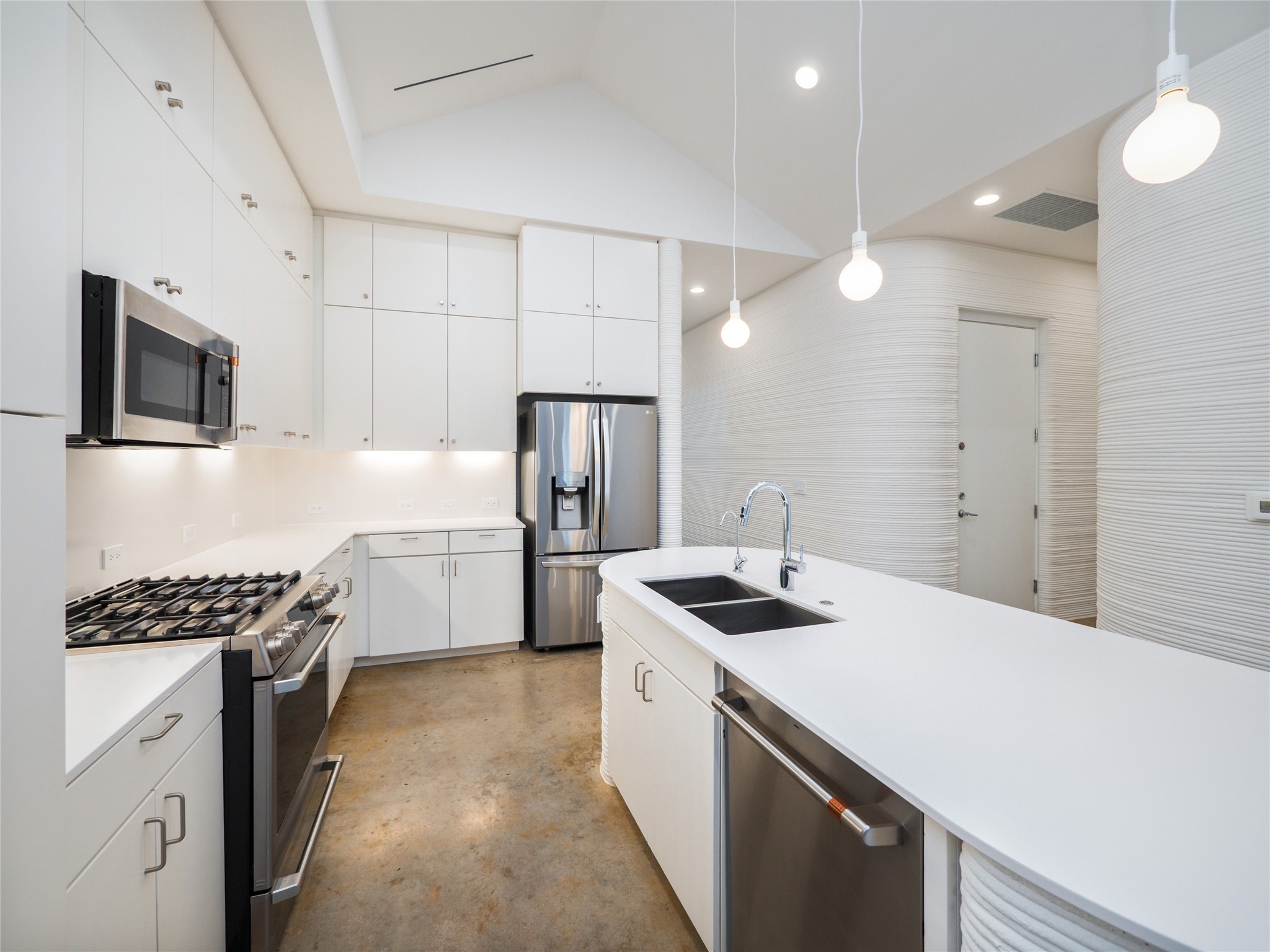304 Painted Sunset Drive Georgetown, TX 78628 - Photo 10 of 38 a kitchen with a sink stove and refrigerator