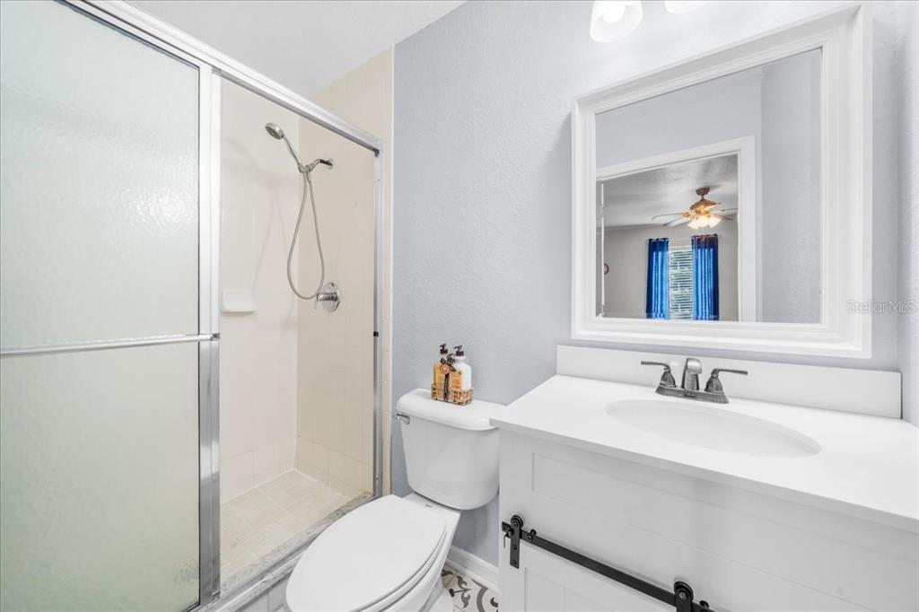 8890 Southwest 33rd Court Ocala, FL 34476 - Photo 22 of 58 a bathroom with a sink toilet and shower