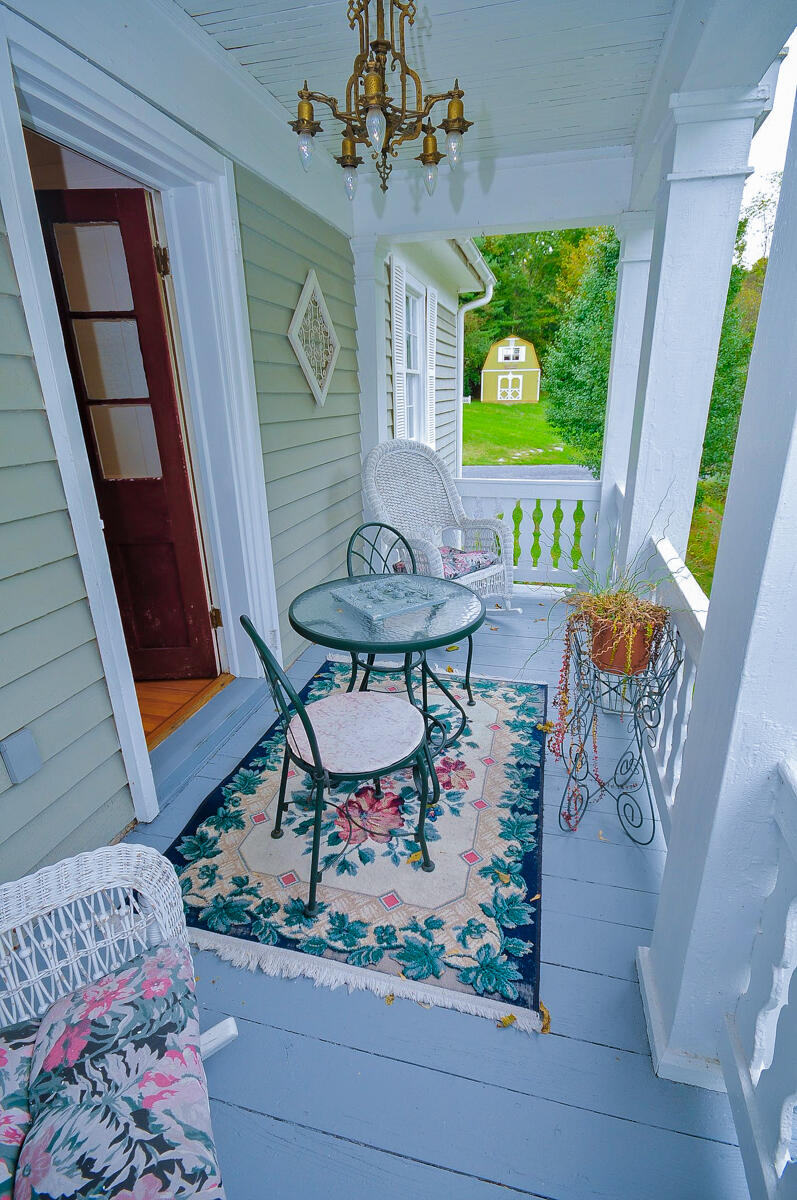 492 Greenhouse Road Lexington, VA 24450 - Photo 16 of 27 a view of a dining room with furniture a chandelier and wooden floor
